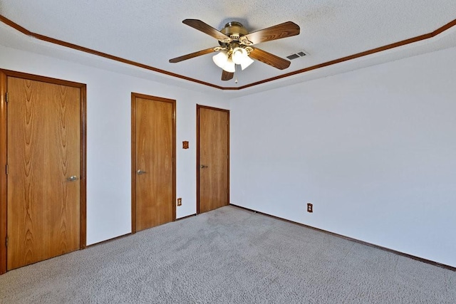 7254 Hialeah Cir W, North Richland Hills, TX 76182 - unfurnished bedroom featuring carpet, two closets, and ceiling fan