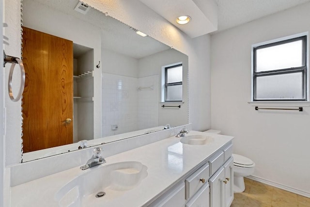7254 Hialeah Cir W, North Richland Hills, TX 76182 - bathroom featuring double vanity, a shower, and recessed lighting