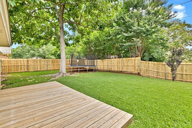7254 Hialeah Cir W, North Richland Hills, TX 76182 - wooden deck featuring a trampoline and a fenced backyard