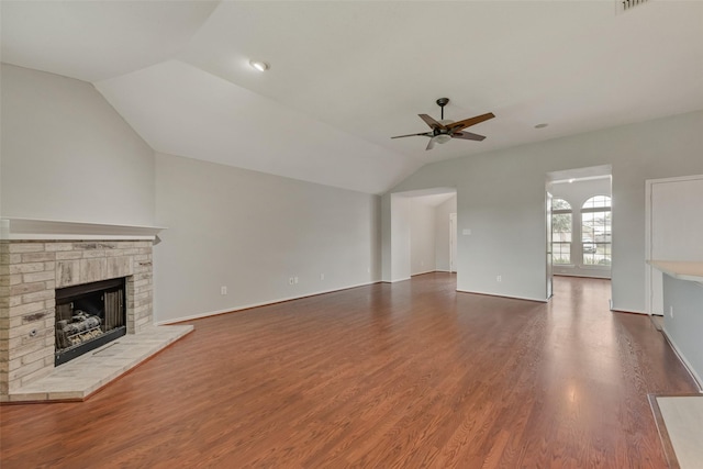 122 Ashbrook Trl, Forney, TX 75126 - unfurnished living room with lofted ceiling, a ceiling fan, a brick fireplace, and wood finished floors