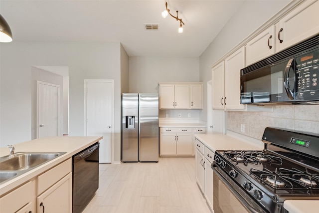 122 Ashbrook Trl, Forney, TX 75126 - kitchen featuring black appliances, light countertops, decorative backsplash, and white cabinetry