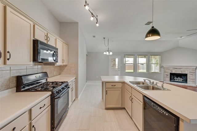 122 Ashbrook Trl, Forney, TX 75126 - kitchen featuring black appliances, vaulted ceiling, open floor plan, tasteful backsplash, and light countertops