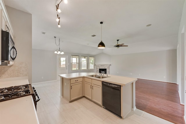 122 Ashbrook Trl, Forney, TX 75126 - kitchen featuring black appliances, open floor plan, ceiling fan, a stone fireplace, and vaulted ceiling