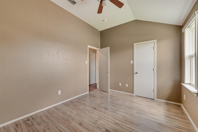 122 Ashbrook Trl, Forney, TX 75126 - unfurnished bedroom featuring lofted ceiling, light wood-style flooring, and ceiling fan