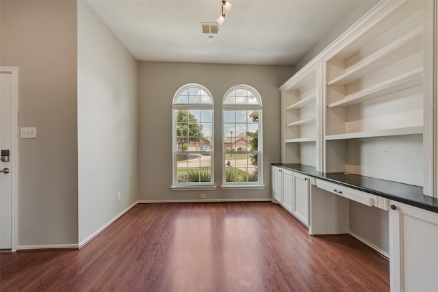 122 Ashbrook Trl, Forney, TX 75126 - unfurnished office with dark wood finished floors and built in desk