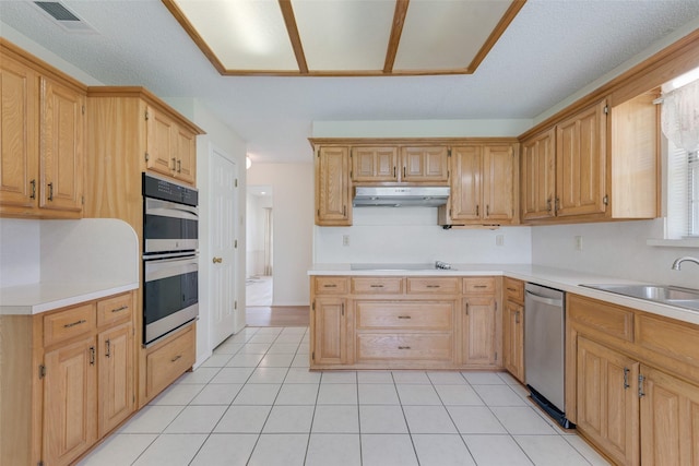 11275 Old Military Trl, Forney, TX 75126 - kitchen featuring stainless steel appliances, under cabinet range hood, light countertops, light tile patterned flooring, and light brown cabinets