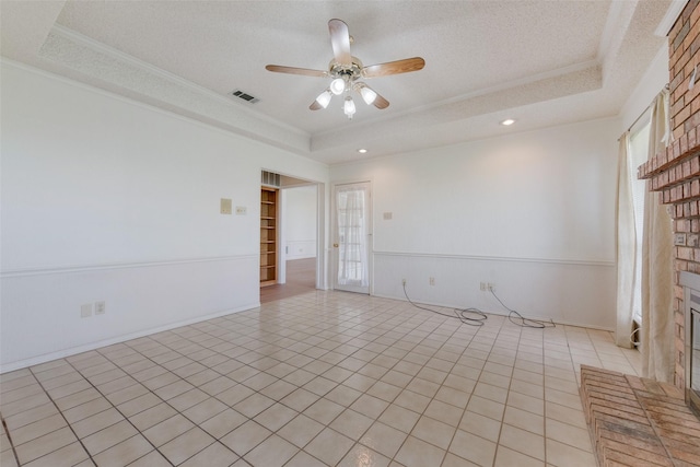 11275 Old Military Trl, Forney, TX 75126 - unfurnished room with a tray ceiling, a ceiling fan, ornamental molding, light tile patterned flooring, and recessed lighting