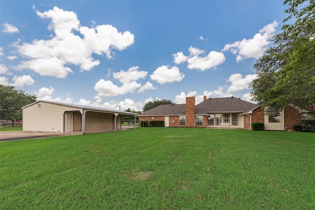 11275 Old Military Trl, Forney, TX 75126 - rear view of house with a chimney, a lawn, an outbuilding, and brick siding