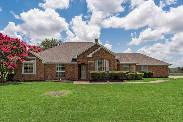 11275 Old Military Trl, Forney, TX 75126 - ranch-style home featuring brick siding, roof with shingles, a chimney, and a front lawn