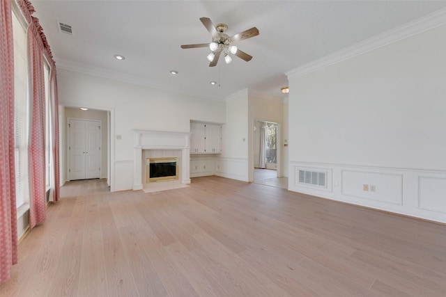 11275 Old Military Trl, Forney, TX 75126 - unfurnished living room featuring ornamental molding, a ceiling fan, light wood finished floors, a fireplace with flush hearth, and recessed lighting