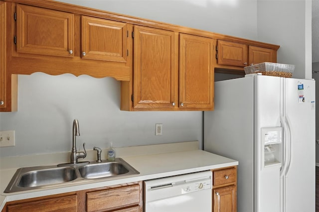 1450 Hampton Rd, Grapevine, TX 76051 - kitchen featuring white appliances, light countertops, and brown cabinets