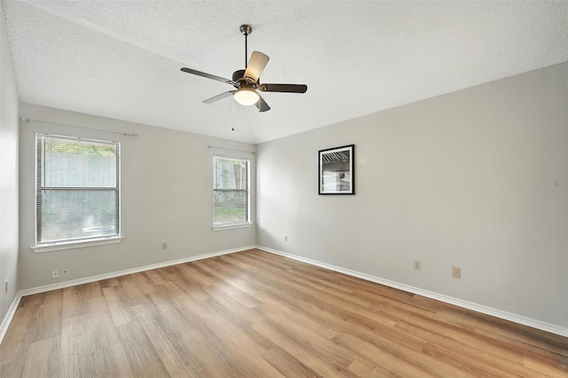 1450 Hampton Rd, Grapevine, TX 76051 - unfurnished room with light wood-style flooring, a ceiling fan, and a textured ceiling