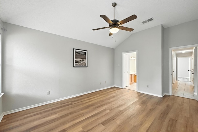 1450 Hampton Rd, Grapevine, TX 76051 - unfurnished bedroom with lofted ceiling, light wood-style floors, connected bathroom, and a ceiling fan