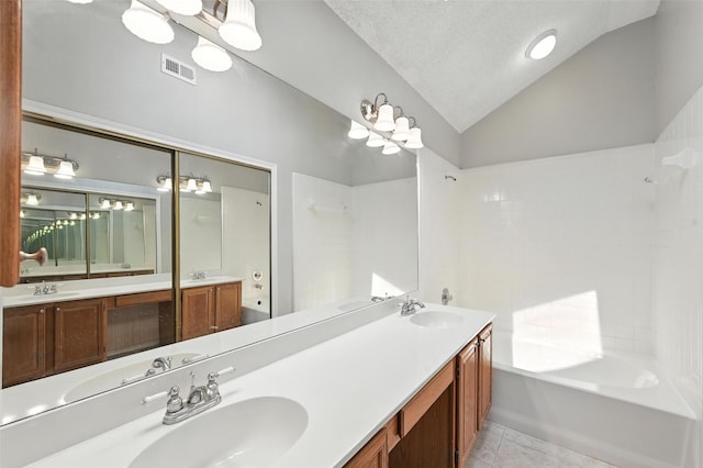 1450 Hampton Rd, Grapevine, TX 76051 - bathroom featuring tile patterned flooring, double vanity, shower / bath combination, a textured ceiling, and high vaulted ceiling