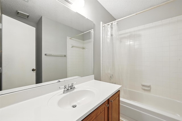 1450 Hampton Rd, Grapevine, TX 76051 - full bath featuring a textured ceiling, vanity, and shower / tub combo with curtain