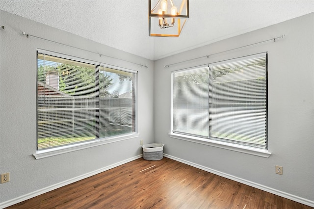 1450 Hampton Rd, Grapevine, TX 76051 - unfurnished room with wood finished floors and a chandelier