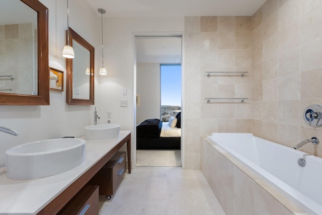 2200 Victory Ave Unit 1105, Dallas, TX 75219 - ensuite bathroom featuring double vanity and tiled bath
