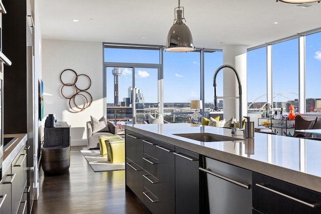 2200 Victory Ave Unit 1105, Dallas, TX 75219 - kitchen featuring a view of skyline, modern cabinets, dark wood-type flooring, decorative light fixtures, and dark cabinetry