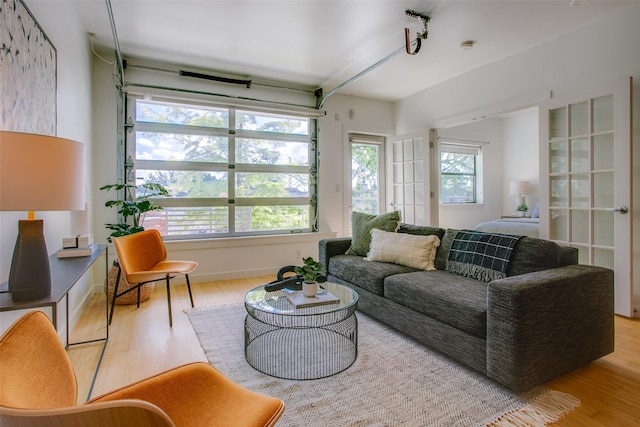1111 S Akard St Unit 310, Dallas, TX 75215 - living room featuring wood finished floors