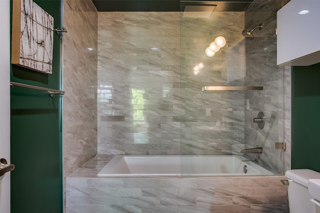 1111 S Akard St Unit 310, Dallas, TX 75215 - bathroom featuring tiled shower / bath and toilet