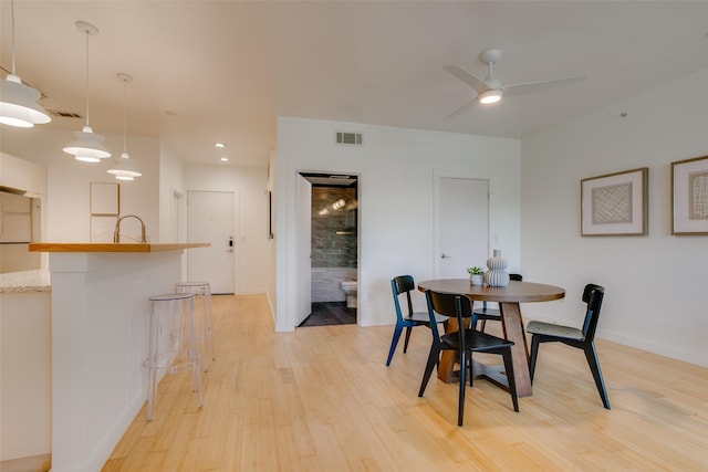 1111 S Akard St Unit 310, Dallas, TX 75215 - dining room featuring light wood-type flooring and ceiling fan