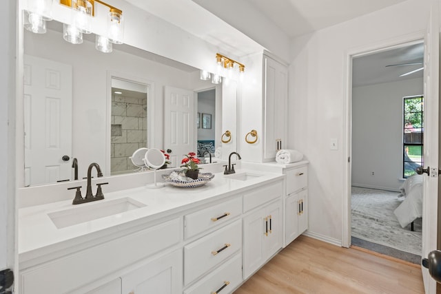 3948 Camino Dr, Plano, TX 75074 - ensuite bathroom featuring double vanity and wood finished floors