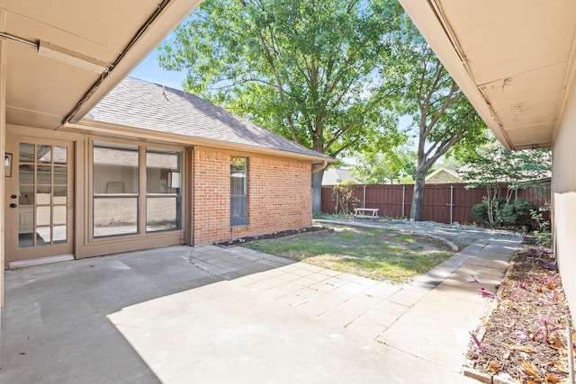 3948 Camino Dr, Plano, TX 75074 - fenced backyard with a patio area