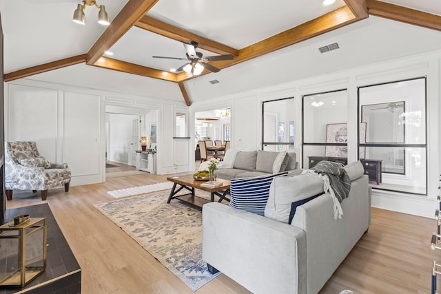 3948 Camino Dr, Plano, TX 75074 - living area featuring a decorative wall, ceiling fan, and light wood finished floors
