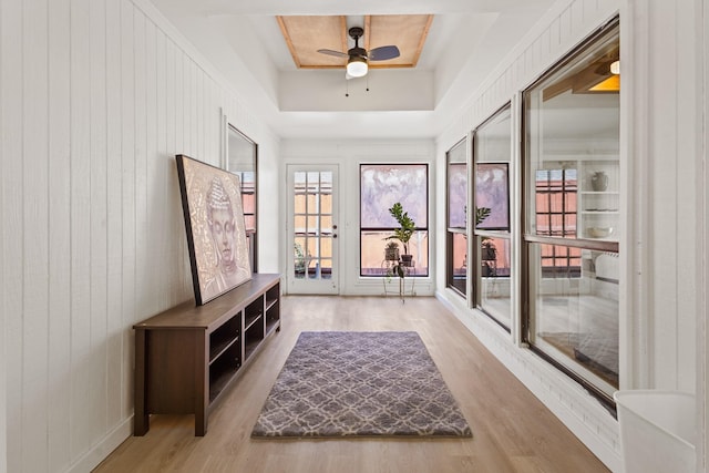 3948 Camino Dr, Plano, TX 75074 - entryway with a raised ceiling, wood finished floors, plenty of natural light, a ceiling fan, and wooden walls
