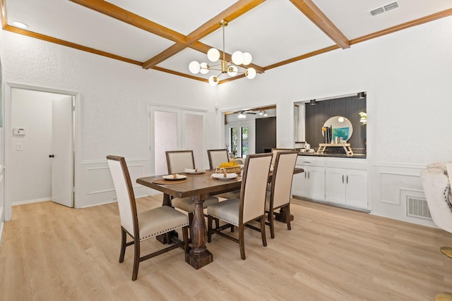 3948 Camino Dr, Plano, TX 75074 - dining space with coffered ceiling, beam ceiling, a chandelier, light wood finished floors, and a decorative wall