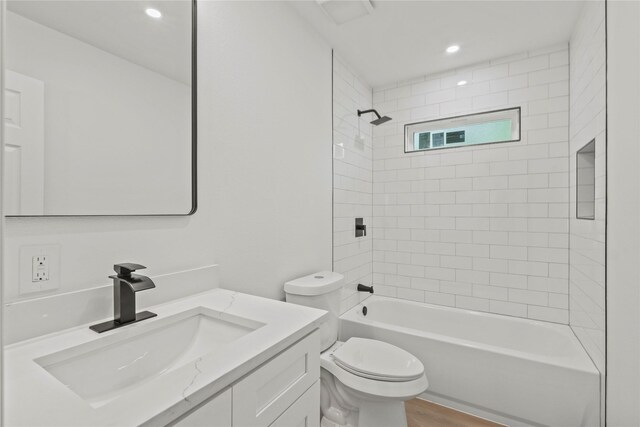 812 Sylvan Dr, Garland, TX 75040 - full bath with vanity, bathtub / shower combination, recessed lighting, and wood finished floors