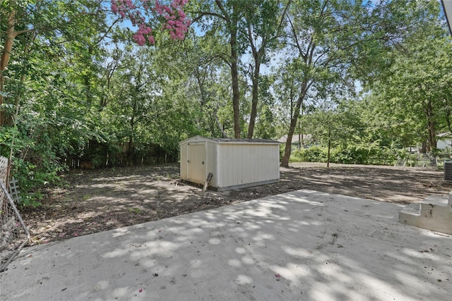 812 Sylvan Dr, Garland, TX 75040 - view of patio with a storage shed