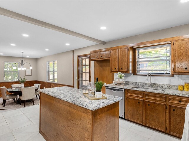 4108 Grand Lake Dr, Lake Worth, TX 76135 - kitchen featuring dishwasher, brown cabinetry, a center island, recessed lighting, and a chandelier