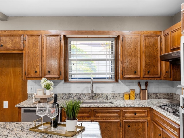 4108 Grand Lake Dr, Lake Worth, TX 76135 - kitchen featuring brown cabinetry and decorative backsplash