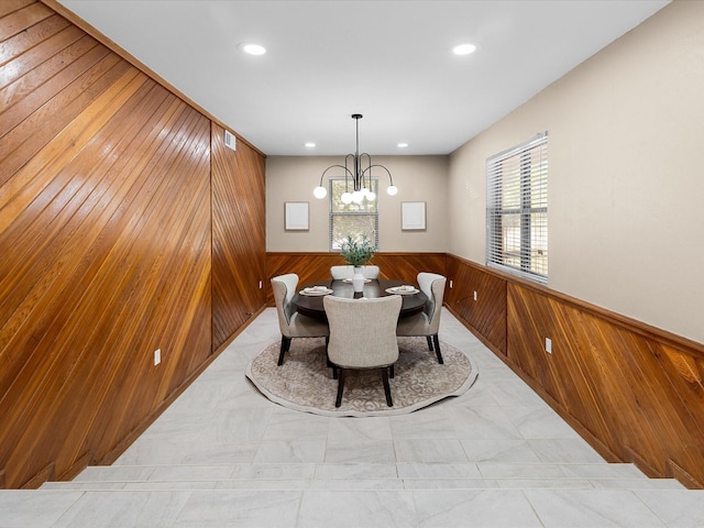 4108 Grand Lake Dr, Lake Worth, TX 76135 - dining room with wood walls, a wainscoted wall, recessed lighting, marble finish floors, and a chandelier