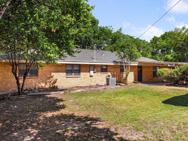 4108 Grand Lake Dr, Lake Worth, TX 76135 - rear view of house with brick siding, a lawn, and roof with shingles