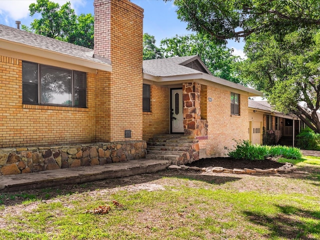 4108 Grand Lake Dr, Lake Worth, TX 76135 - view of front facade featuring a chimney, brick siding, a shingled roof, and a front lawn