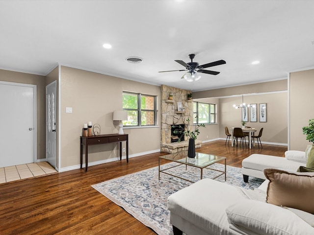 4108 Grand Lake Dr, Lake Worth, TX 76135 - living area featuring wood finished floors, crown molding, ceiling fan, a stone fireplace, and recessed lighting