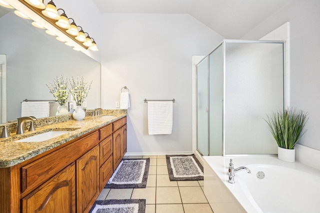 8700 Blacktail Trl, Mckinney, TX 75070 - bathroom featuring double vanity, a stall shower, a garden tub, vaulted ceiling, and tile patterned flooring