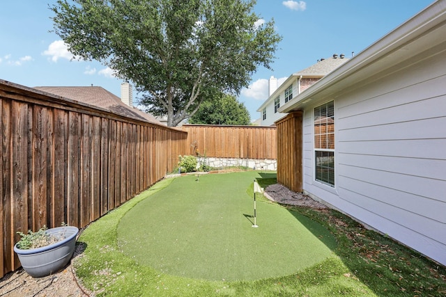 8700 Blacktail Trl, Mckinney, TX 75070 - fenced backyard featuring an area to practice putting
