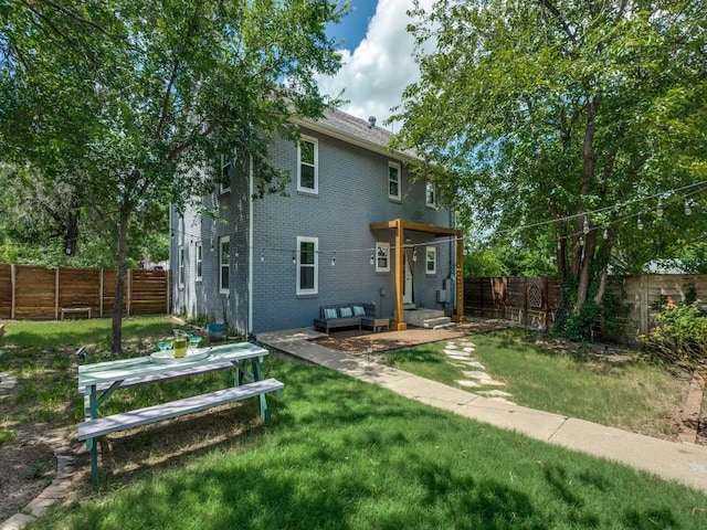 2719 W 12th St, Dallas, TX 75211 - rear view of property featuring brick siding and a fenced backyard