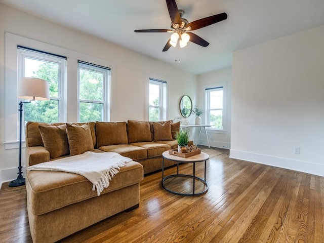 2719 W 12th St, Dallas, TX 75211 - living room featuring healthy amount of natural light, wood finished floors, and ceiling fan
