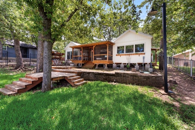 111 Adams Row, Streetman, TX 75859 - rear view of house with a sunroom and stairway