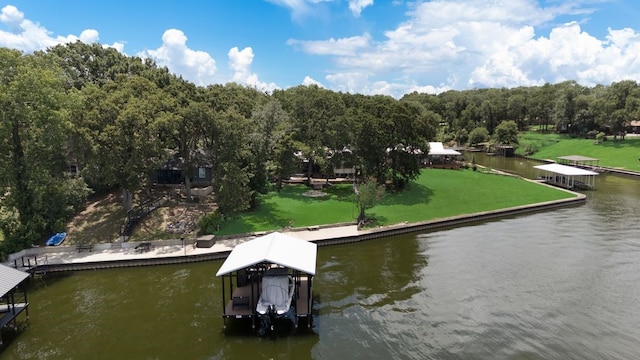 111 Adams Row, Streetman, TX 75859 - dock featuring a water view, boat lift, and a lawn