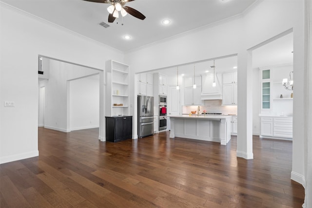 1014 Ember Crest Dr, Rockwall, TX 75087 - unfurnished living room with ceiling fan, ornamental molding, dark wood-style flooring, built in shelves, and recessed lighting