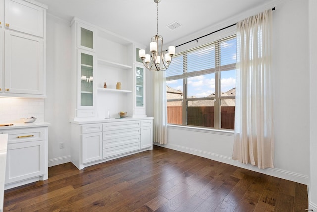 1014 Ember Crest Dr, Rockwall, TX 75087 - unfurnished dining area featuring a chandelier and dark wood-type flooring