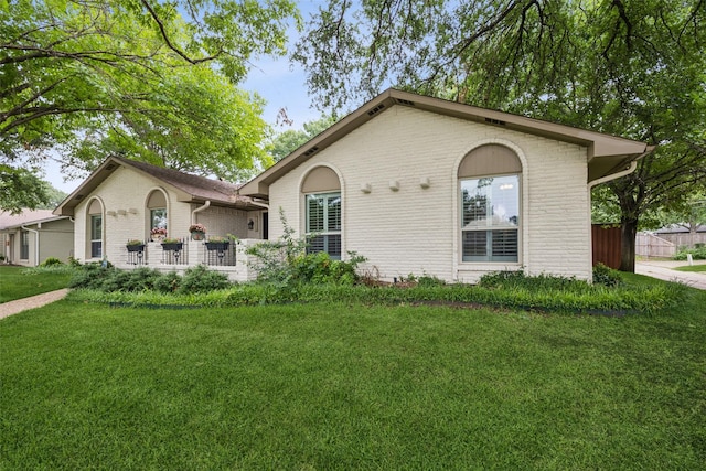 12312 Cox Ln, Dallas, TX 75244 - ranch-style home with brick siding and a front yard