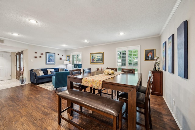 12312 Cox Ln, Dallas, TX 75244 - dining room with a textured ceiling, crown molding, healthy amount of natural light, recessed lighting, and wood finished floors