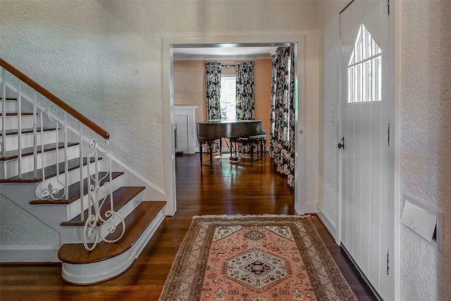 6224 Curzon Ave, Fort Worth, TX 76116 - foyer featuring a textured wall, wood finished floors, and stairway