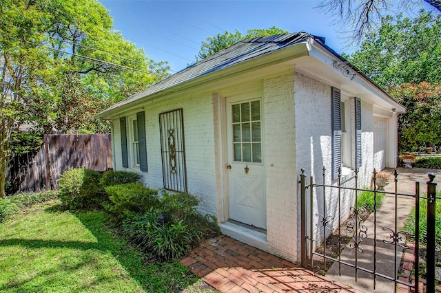6224 Curzon Ave, Fort Worth, TX 76116 - doorway to property featuring brick siding, a garage, a gate, and driveway